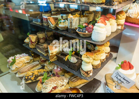 Various freshly made desserts on display in a restaurant. Stock Photo