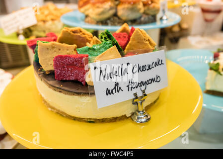 Nutella cheesecake with honeycomb dessert on display in a restaurant Stock Photo