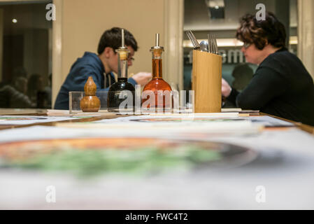 Two customers sitting at a table in Wagamama restaurant. Stock Photo