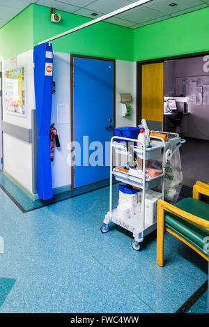 Cleaner's trolley outside a clinical investigation room of a hospital. Stock Photo