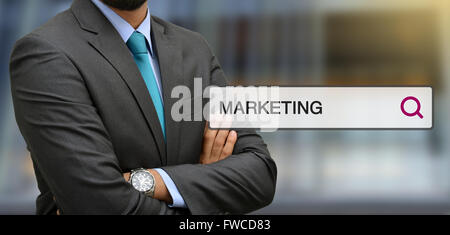 Professional standing in front of office with marketing search bar illustrations. Stock Photo