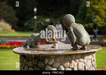 Valley Gardens, Harrogate, Yorkshire, England - close-up of sculpture, flowing water and water drops, on the Cherub Fountain in this beautiful park. Stock Photo