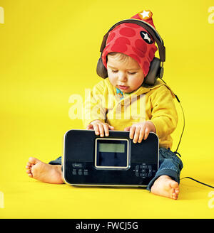 Happy little boy wearing headphones Stock Photo