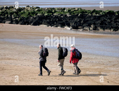 New Brighton, UK. 3rd  April, 2016. UK Weather: Bright sunny day. People enjoy a walk on the beach Credit:  Alan Edwards/Alamy Live News Stock Photo