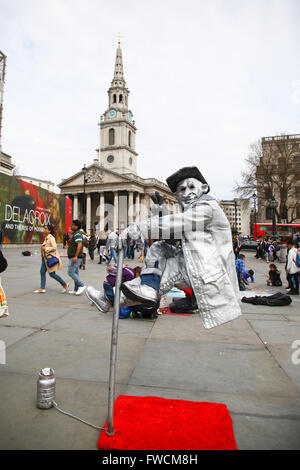 London 3 April 2016 A busker in Trafalgar Square while the tourists walks by Credit:  Dinendra Haria/Alamy Live News Stock Photo