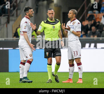 Milan, Italy. 3 April, 2016: Cesare Bovo (left) and Bruno Peres (right) speak with the referee Marco Guida (middle) during the Serie A Match between FC Internazionale and Torino FC at Giuseppe Meazza stadium. Credit:  Nicolò Campo/Alamy Live News Stock Photo