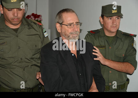 Buenos Aires, Argentina. 3rd Apr, 2016. Argentina's former Transport Secretary Ricardo Raul Jaime (C) is escorted by security members at the Sentinel Building of the National Gendarmerie in Buenos Aires, Argentina, on April 3, 2016. According to local press, former Transport Secretary Ricardo Jaime turned himself in on Saturday night to Cordoba authorities after declaring the arrest warrant against him for alleged irregularities in purchase of trains made in 2005 to Spain and Portugal. © GNA/TELAM/Xinhua/Alamy Live News Stock Photo