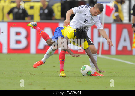 Boca Raton, FL, USA. 29th May, 2013. Germany midfielder Lukas Podolski (10) and Ecuador's Juan Carlos Paredes (4) collide join for a ball during an international friendly against Ecuador at FAU Stadium in Boca Raton, Florida on May 29, 2013. Germany won 4-2.ZUMA PRESS/Scott A. Miller © Scott A. Miller/ZUMA Wire/Alamy Live News Stock Photo