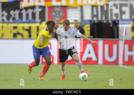 Boca Raton, FL, USA. 29th May, 2013. Germany midfielder Lukas Podolski (10) and Ecuador's Juan Carlos Paredes (4) collide join for a ball during an international friendly against Ecuador at FAU Stadium in Boca Raton, Florida on May 29, 2013. Germany won 4-2.ZUMA PRESS/Scott A. Miller © Scott A. Miller/ZUMA Wire/Alamy Live News Stock Photo