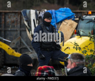 Riot police, bulldozers, activists and refugees on the fourth day of the evictions and demolition of the Calais Jungle.  Featuring: View Where: Calais, United Kingdom When: 03 Mar 2016 Stock Photo