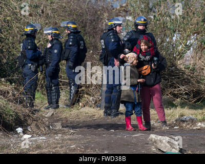 Riot police, bulldozers, activists and refugees on the fourth day of the evictions and demolition of the Calais Jungle.  Featuring: View Where: Calais, United Kingdom When: 03 Mar 2016 Stock Photo
