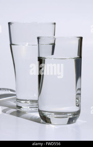 Drinking Water In Glass On White Background. Stock Photo