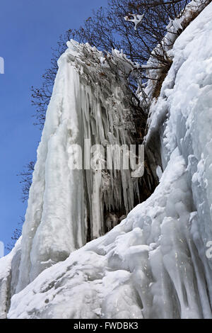 Beautiful icicles on rocks. Stock Photo