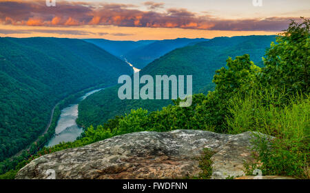 Sunset from the main overlook at Grandview, West Virginia shows the rolling hills cradling the river below. Stock Photo