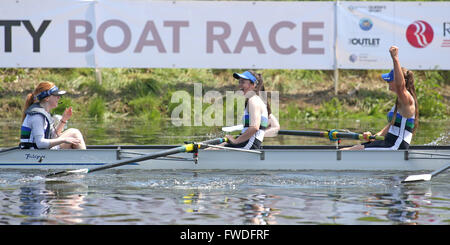 Queen's University Women's Freshers Catherine Campbell (cox), Emma McKee and Rebecca Mackey and crew celebrate after they beat Trinity College Dublin in the Freshers Women's Race at this year Ramada Plaza University Boat Race 2013 on the River Lagan, Belfast, June 8, 2013. Stock Photo