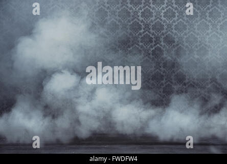 Old vintage room filled with dense white smoke Stock Photo