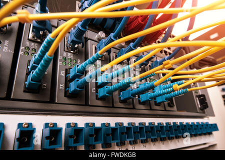 Fiber optic connecting on core network swtich Stock Photo