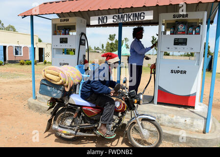 KENYA Kisumu, woman work at petrol station