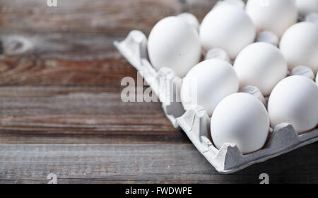 White eggs on a rustic wooden table Stock Photo
