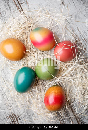 Colorful easter eggs on straw Stock Photo