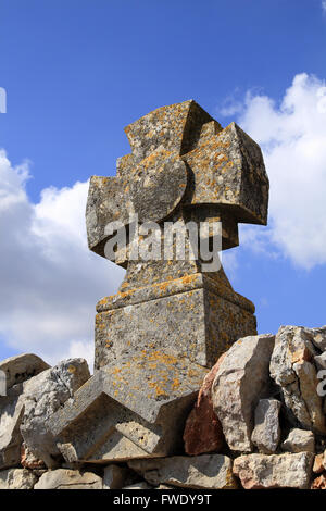 Cross on a wall near the old windmill of Saint Pierre De La Fage in Languedoc Roussillon, France Stock Photo