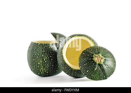 Couple of eight ball squash with cut top and scooped out pulp isolated on white. Stock Photo