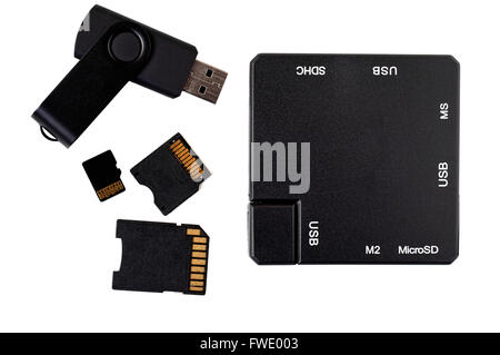 Top view of black plastic square USB hub, memory stick and card adapters. Stock Photo