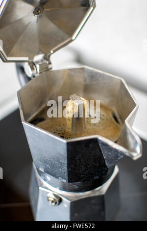 Italian vintage coffeepot on kitchen stove, close up Stock Photo