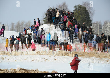 Kovrov, Russia. 22 February 2015. Winter motocross competitions. Spectators watch the race Stock Photo