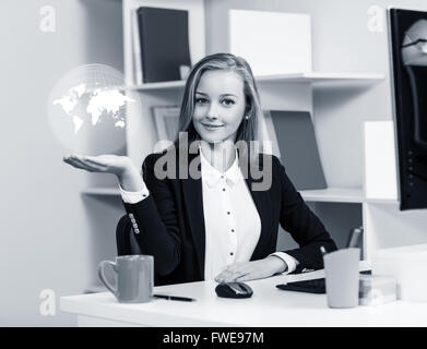 Young business woman present digital map Stock Photo