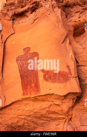 Crowned Figure Pictograph, Barrier Canyon style, rock alcove near Hog Springs Picnic Area, Bicentennial Highway, Utah, USA Stock Photo