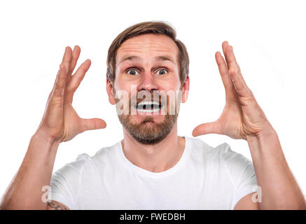 Portrait of young man surprised isolated on a white background Stock Photo