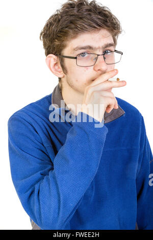 Teenage boy with cigarette in his mouth Stock Photo