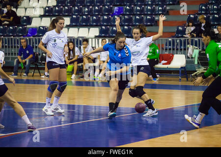 young women handball match held in a sports centre Stock Photo