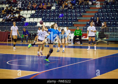 young women handball match held in a sports centre Stock Photo