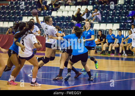 young women handball match held in a sports centre Stock Photo