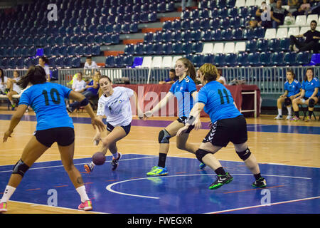 young women handball match held in a sports centre Stock Photo