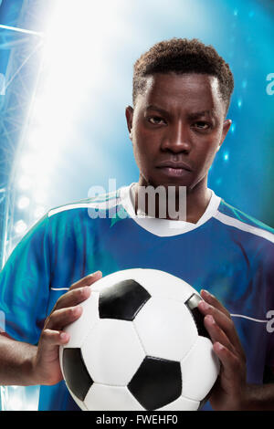 Athlete with soccer ball Stock Photo