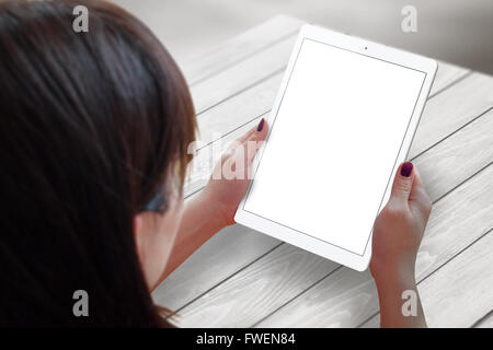 Tablet in woman hands. Isolated white screen for mockup. Stock Photo