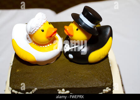 Rubber ducks are the cake toppers for this wedding cake at a very non-traditional reception for the bride and groom. Stock Photo