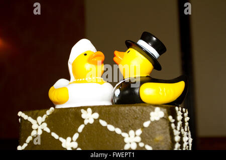 Rubber ducks are the cake toppers for this wedding cake at a very non-traditional reception for the bride and groom. Stock Photo