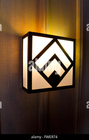 Historic Timberline lodge light fixtures on an old wooden wall in a hallway. Stock Photo