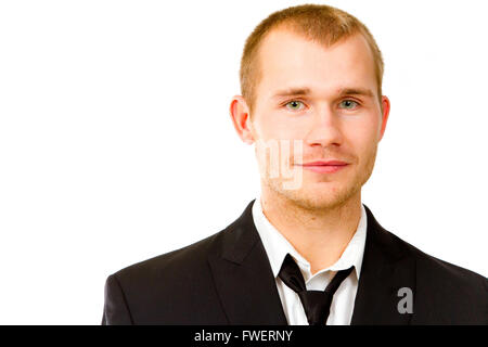 This handsome groom is isolated against a white background in the studio to create a portrait of a man that could be getting mar Stock Photo