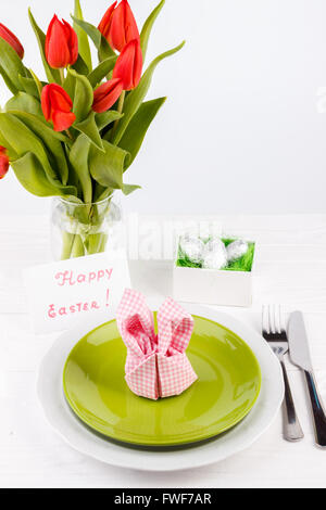 Easter table setting on white wooden table Stock Photo