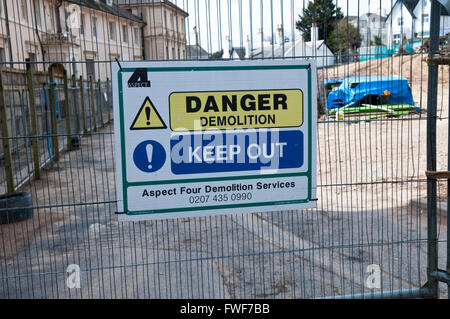 Sign on a building site saying Danger Demolition Keep Out Stock Photo