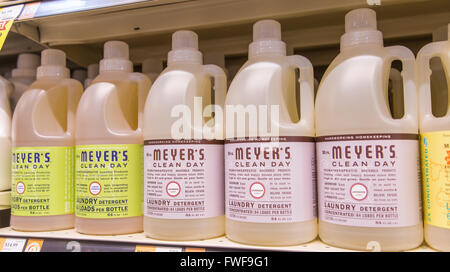 a display of Mrs. Meyer's laundry detergent bottles on the shelf of a grocery store Stock Photo