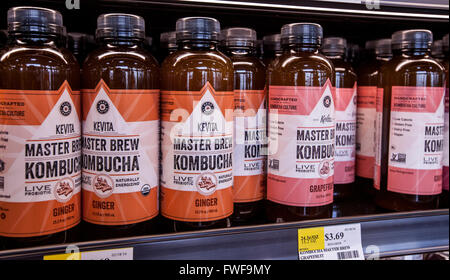 Bottles of kombucha tea on the shelf of a grocery store Stock Photo