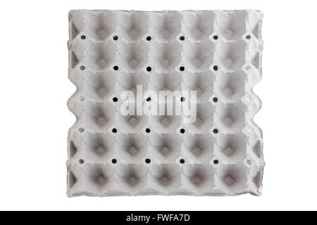 empty egg panel on isolated white background with clipping paths. And eggs in the same light conditions in uniform. To be arrang Stock Photo