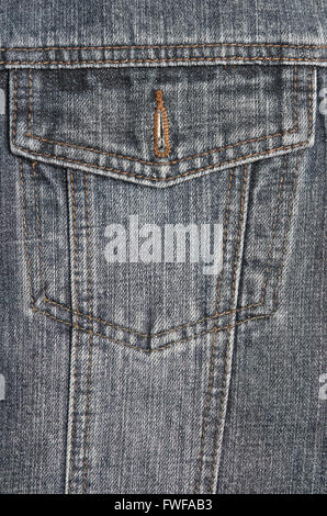 Pocket detail of a washed out denim jacket. Fashion and garments Stock Photo