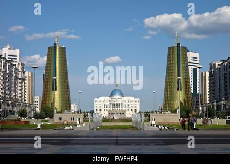 View along Nurzhol Bulvar to the presidential palace Ak Orda in Kazakhstan's young capital Astana. On the right and left side conical office buildings covered with golden-green glass. Picture taken 2013-06-21. Stock Photo
